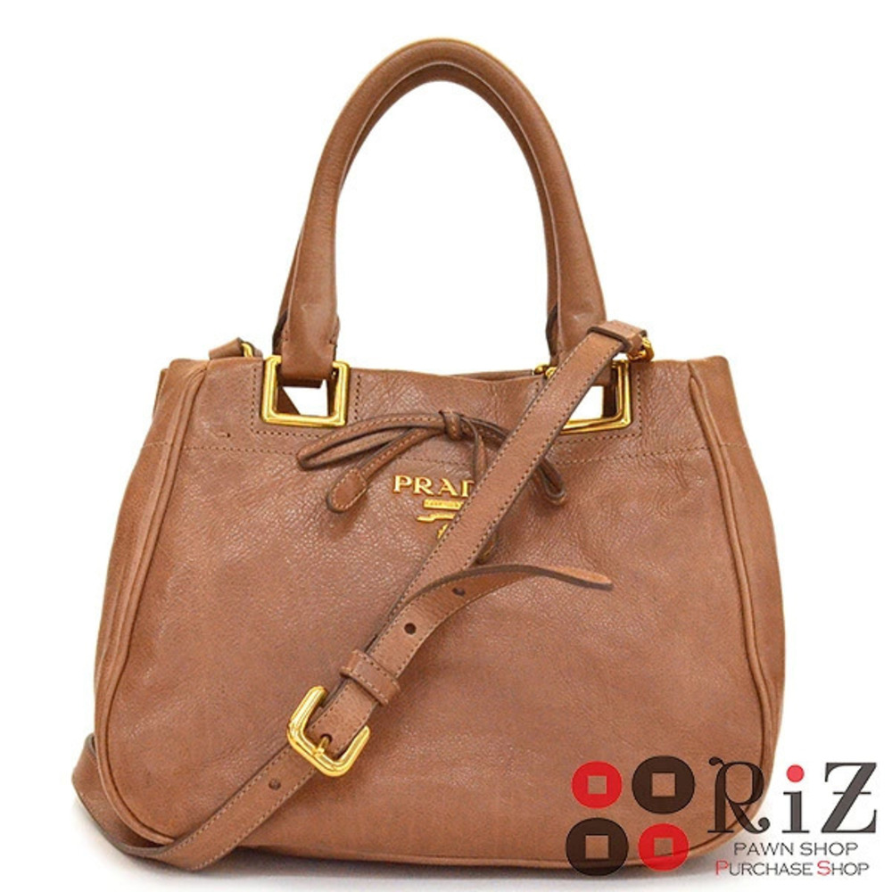 Prada handbag distinct bow Brown